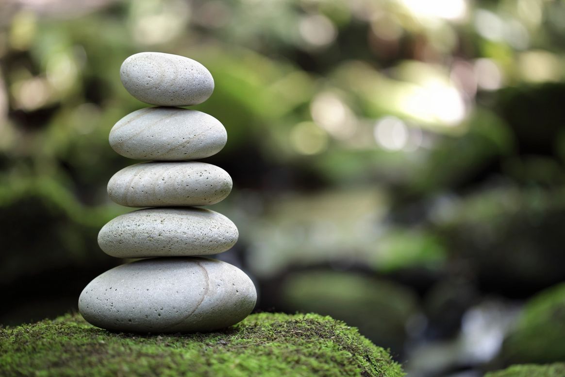 Balanced zen stones in still water
